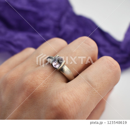 Statement ring for women on a purple background, fine jewelry concept, promotional photo for an online vintage and handmade jewelry store Statement ring for women on a purple background, fine jewelry concept, promotional photo for an online vintage and handmade jewelry store 123548619