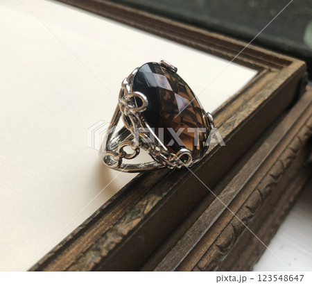 Statement ring for women on a white background, fine jewelry concept,  promotional photo for an online vintage and handmade jewelry store 123548647