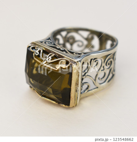 Statement ring for women on a white background, fine jewelry concept, promotional photo for an online vintage and handmade jewelry store Statement ring for women on a white background, fine jewelry concept, promotional photo for an online vintage and handmade jewelry store 123548662