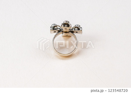 Statement ring for women on a white background, fine jewelry concept, promotional photo for an online vintage and handmade jewelry store Statement ring for women on a white background, fine jewelry concept, promotional photo for an online vintage and handmade jewelry store 123548720