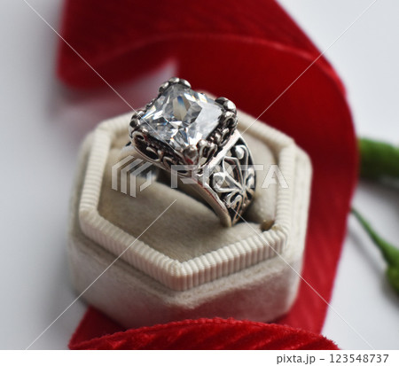 Statement ring for women on a white background, fine jewelry concept, promotional photo for an online vintage and handmade jewelry store Statement ring for women on a white background, fine jewelry concept, promotional photo for an online vintage and handmade jewelry store 123548737