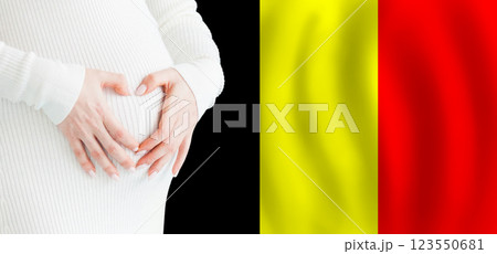 Demographics, pregnancy and love baby in Belgium concept. Pregnant woman making heart  123550681