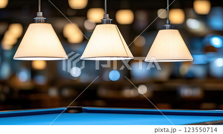 Blue billiard table set with white balls creates an inviting atmosphere in a lively bar, perfect for socializing and gameplay 123550714