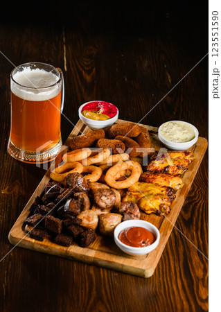 Beer snack platter with fried appetizers and sauces Beer snack platter with fried appetizers and sauces 123551590