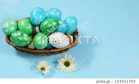 Decorated golden eggs on a trendy blue background. Minimal holiday concept. Happy Easter background, place for text, postcard, banner for the screen. Decorated golden eggs on a trendy blue background. Minimal holiday concept. Happy Easter background, place for text, postcard, banner for the screen. 123551703