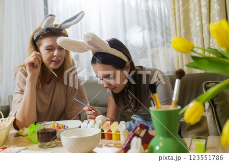 Mother And Daughter Enjoy Painting Easter Eggs 123551786