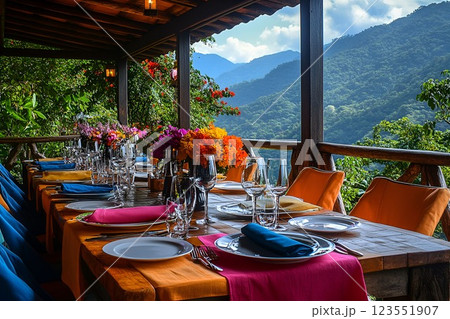 Elegant outdoor dining with colorful table setting and mountain view 123551907