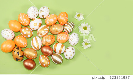 Happy Easter concept, spring greeting card, composition with gold decorated eggs on a delicate background. Minimal holiday concept, space for text, banner for screen, selective focus Happy Easter concept, spring greeting card, composition with gold decorated eggs on a delicate background. Minimal holiday concept, space for text, banner for screen, selective focus 123551987