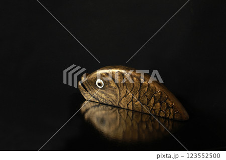 Goldfish, golden reflection, black background Goldfish, golden reflection, black background 123552500