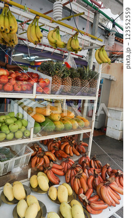 A very colorful market stall full of fruits at the wet market in Chinatown at Singapore. 123552559