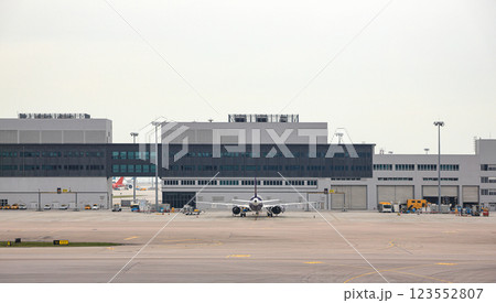 Airplane parking at parking bay. Service passengers by bus from bus gate. 123552807