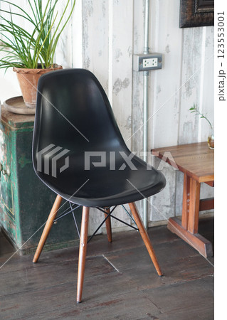 old black wooden chair on wooden floor, white wall background, nature, object, decor, copy space 123553001