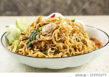 front view of fried noodles close up with meatball topping, fried egg, home made Indonesian food 123553277