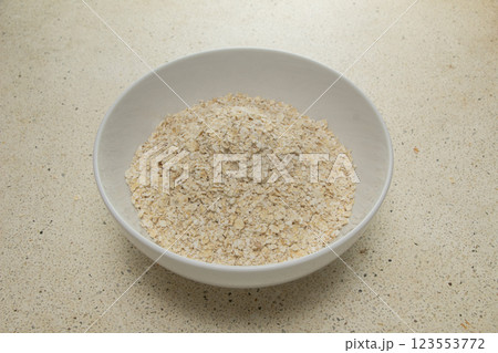 a bowl of still-dry oatmeal sat 123553772