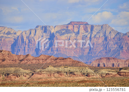 Red Rock Cliffs and Desert Landscape at Golden Hour Eye-Level View Red Rock Cliffs and Desert Landscape at Golden Hour Eye-Level View 123556781