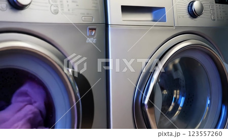 Washing machine filling with clothes 123557260
