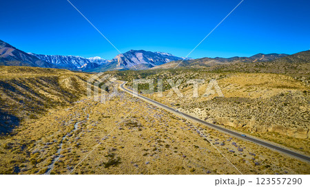 Aerial of Winding Road Through Nevada's Rugged Mountain Terrain Aerial of Winding Road Through Nevada's Rugged Mountain Terrain 123557290