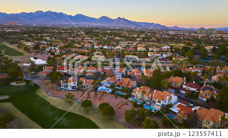 Aerial Las Vegas Suburban Sunset with Mountain Backdrop 123557411