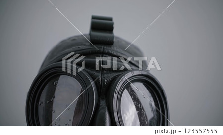 Black Gas Mask with Rain Drops on a White Background 123557555