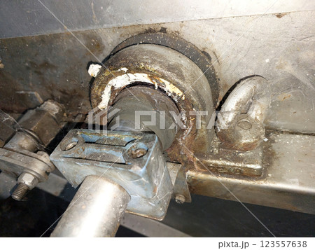 Machinery Component Showing Industrial Wear and Tear on Bearing Support Machinery Component Showing Industrial Wear and Tear on Bearing Support 123557638