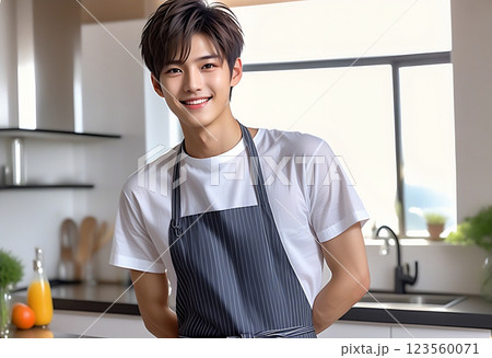 朝日の差し込む広いキッチンに立つエプロンをしたかっこいい男性　AI生成 123560071