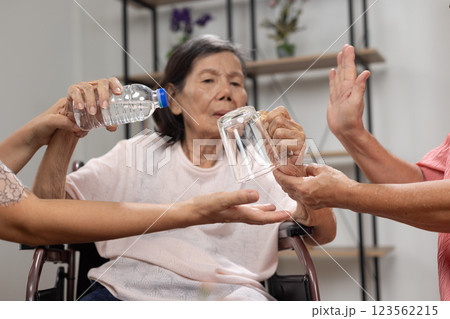 Alzheimer's elderly woman is holding things in unusual position. Alzheimer's elderly woman is holding things in unusual position. 123562215