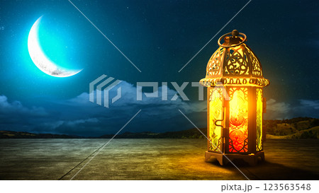 Traditional glowing Arabic lantern with crescent moon view on night scene background. Copy space or mockup. Concept of Eid Al Fitr and Ramadan Mubarak. Islamic background 123563548
