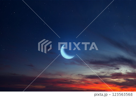 Islamic night sunset with a view of the crescent moon. Hilal and Eid at night with some clouds in the sky. Copy space or mockup. Concept of Eid Al Fitr and Ramadan Mubarak. Ramadan background Islamic night sunset with a view of the crescent moon. Hilal and Eid at night with some clouds in the sky. Copy space or mockup. Concept of Eid Al Fitr and Ramadan Mubarak. Ramadan background 123563568