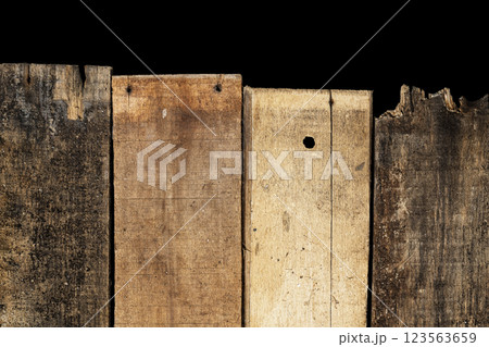 Closeup view arranged wooden fence with a black background. Natural wooden texture or brown background or wallpaper. Copy space or mockup Closeup view arranged wooden fence with a black background. Natural wooden texture or brown background or wallpaper. Copy space or mockup 123563659