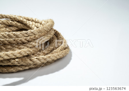 Closeup view of coiled ropes string isolated over a white background Closeup view of coiled ropes string isolated over a white background 123563674