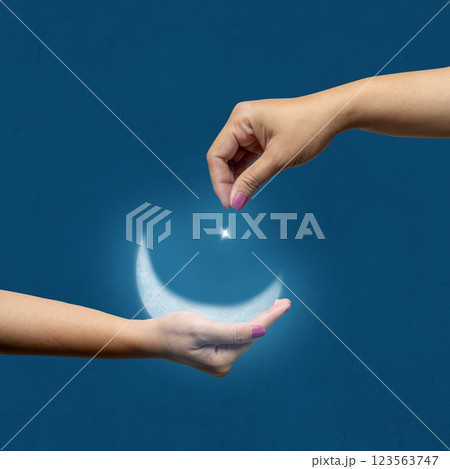 A human hand showing a crescent moon and star in the night scene background. Concept of Religion, Spiritual or Ramadan 123563747