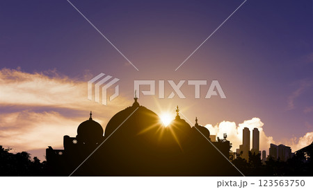 View of the silhouette of the mosque with sunlight in the sunset scene background. Concept of Religion, Spiritual or Ramadan View of the silhouette of the mosque with sunlight in the sunset scene background. Concept of Religion, Spiritual or Ramadan 123563750