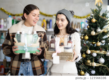 Women friends choose cosmetics gift set for christmas Women friends choose cosmetics gift set for christmas 123566106
