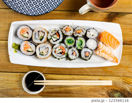 On table there portion set with maki - uramaki and nigiri On table there portion set with maki - uramaki and nigiri 123566116