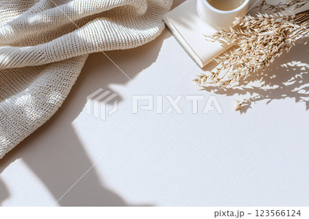 Fashion logo on textured paper with a neutral beige background, representing luxury branding style 123566124