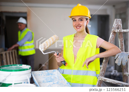 Woman painter posing in house being renovated 123566251