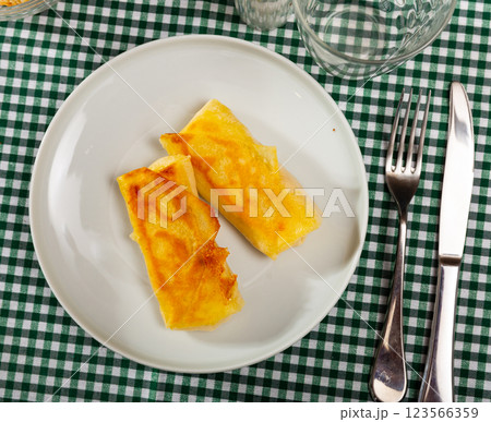 Pancakes stuffed with meat served on platter 123566359