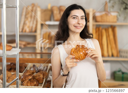 Young woman with courassan in bakery Young woman with courassan in bakery 123566897
