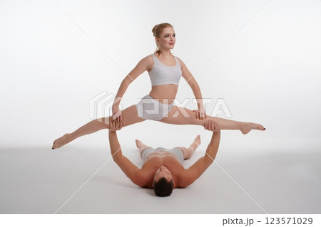 Couple performs acrobatic dance routine showcasing strength and flexibility 123571029
