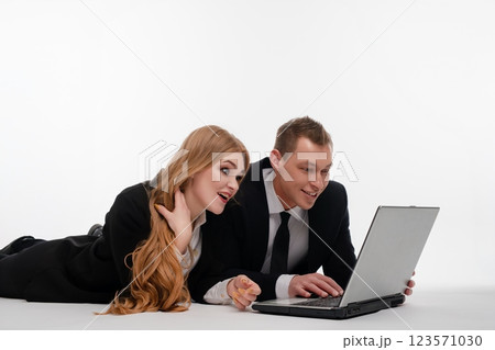 Couple enjoying a productive moment together while working on a laptop 123571030