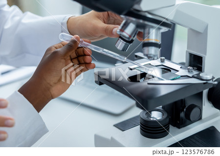 Teacher and a student working in a school scientific laboratory Teacher and a student working in a school scientific laboratory 123576786