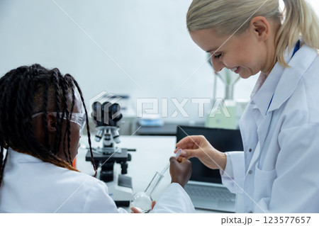 People working in a school laboratory and looking involved 123577657