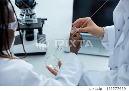 People working in a school laboratory and looking involved 123577659