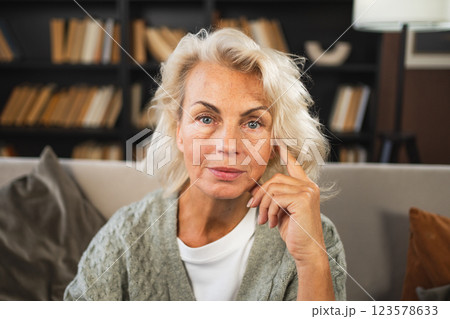 Portrait of confident stylish European middle aged senior woman. Older mature 60s lady smiling at home. Happy attractive senior female looking camera close up face headshot portrait. Happy people Portrait of confident stylish European middle aged senior woman. Older mature 60s lady smiling at home. Happy attractive senior female looking camera close up face headshot portrait. Happy people 123578633