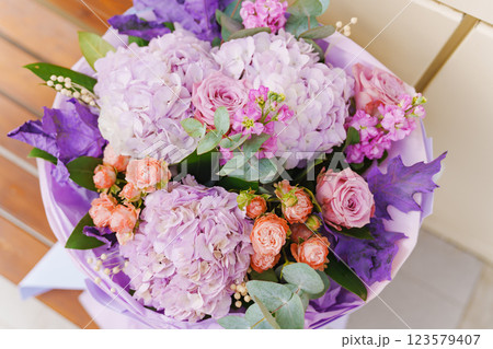A large and beautiful bouquet of pink, purple and orange flowers.  123579407