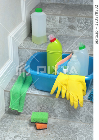 Household cleaning products and items for cleaning tile in house. Cleaning and cleanliness. Household cleaning products and items for cleaning tile in house. Cleaning and cleanliness. 123579532