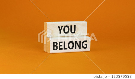 Belonging and you belong symbol. Concept words You belong on beautiful wooden blocks. Beautiful orange background. Business belonging and you belong concept. Copy space. Belonging and you belong symbol. Concept words You belong on beautiful wooden blocks. Beautiful orange background. Business belonging and you belong concept. Copy space. 123579558