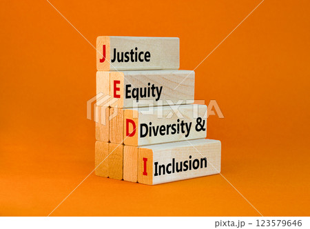 Justice equity diversity inclusion symbol. Concept words JEDI Justice Equity Diversity Inclusion on blocks. Beautiful orange background. Business justice equity diversity inclusion concept. Copy space 123579646