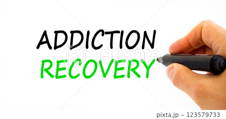 Addiction recovery symbol. Concept words Addiction recovery on beautiful white paper. Psychologist hand. Beautiful white paper background. Psychology addiction recovery concept. Copy space. Addiction recovery symbol. Concept words Addiction recovery on beautiful white paper. Psychologist hand. Beautiful white paper background. Psychology addiction recovery concept. Copy space. 123579733