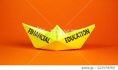 Financial education symbol. Concept words Financial education on beautiful yellow paper boat. Beautiful orange paper background. Business Financial education concept. Copy space. 123579765